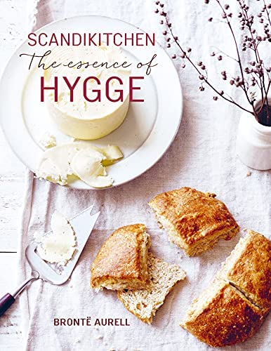 Book cover with title and photo of staged bread and butter on a white tablecloth. 