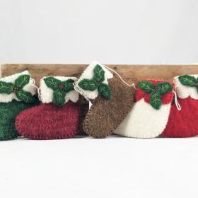 5 small felted wool stockings on a garland