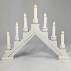 Triangular candelabra with two lines etched in the base. 7 bulbs are turned on with this electric plug in candelabra. 
