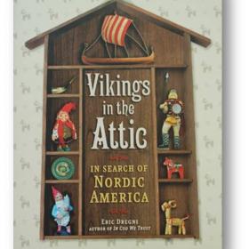 Book cover with title inside a house-shaped shelf with Nordic figurines surrounding it.